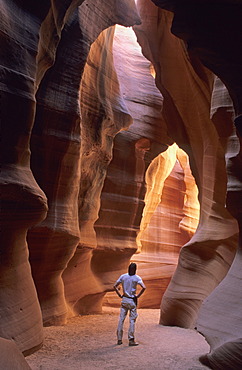 Man standing in Upper Antelope Canyon near Page, Arizona, USA