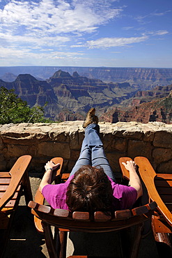 Holidaymaker enjoying the view from the terrace of the Grand Canyon Lodge towards Deva Temple, Brahma Temple, Grand Canyon National Park, North Rim, Arizona, United States of America, USA