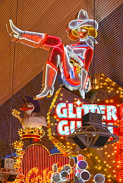 Vicky, the famous cowgirl figure from the neon sign of the Glitter Gulch Casino Hotel, Fremont Street Experience in old Las Vegas, Downtown Las Vegas, Nevada, United States of America, USA, PublicGround