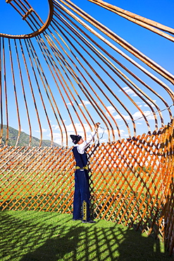 Kazakh men putting up a yurt, Sati village, Tien Shan Mountains, Kazakhstan, Asia