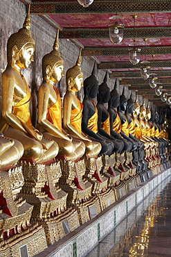 Wall with row of Buddha statues in meditation posture, on decorated pedestals, Phra Rabieng Kot, Wat Suhtat, Royal Temple, Phra Nakhon, Bangkok, Thailand, Asia