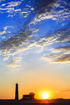 Silhouettes, Lighthouse and Lodge at sunset, Pelican Point, Walvis Bay, Erongo region, Namibia, Africa