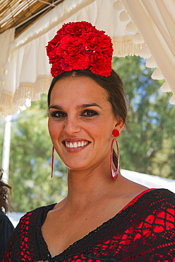 Woman wearing a colourful gypsy dress, Pentecost pilgrimage of El Rocio, Huelva province, Andalusia, Spain, Europe