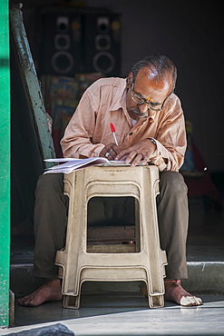 Merchant doing office work, Udaipur, Rajasthan, India, Asia