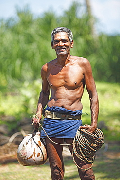 Toddy Tapper with rope for collecting palm juice, Wadduwa, Western Province, Ceylon, Sri Lanka, Asia