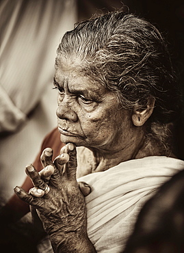 Praying woman at Hindu temple festival, Thrissur, Kerala, South India, India, Asia