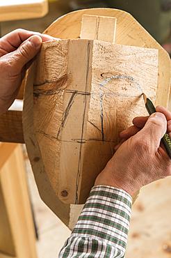 Drawing the outline of a face on a wooden block, wooden mask carver, Bad Aussee, Styria, Austria, Europe