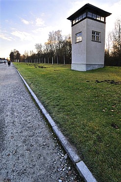 Watchtower, fence and visitors on the camp grounds, Dachau Concentration Camp, Dachau, near Munich, Bavaria, Germany, Europe