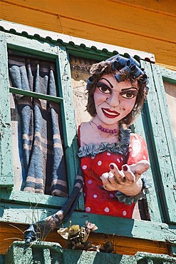 Typical colourful house in the La Boca neighbourhood with large figure of a woman, Buenos Aires, Argentina, South America