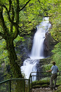 Man in front of waterfall, Gimel les Cascades, Correze, France, Europe