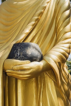 Buddha statue holding a begging bowl, Luang Prabang, UNESCO World Heritage Site, Laos, Indochina, Asia