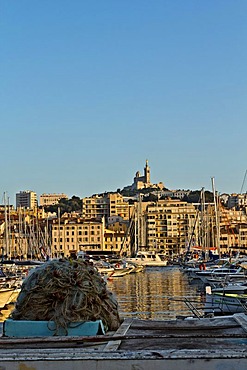 The Old Harbour, Vieux Port, with Basilica Notre Dame de la Garde in the distance, Marseille, Marseilles, Provence-Alpes-Cote d'Azur, France, Europe