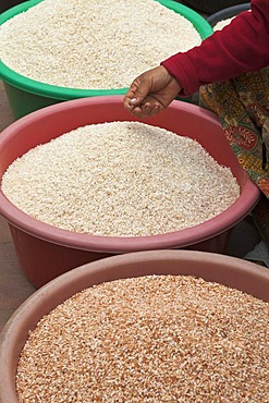 Tubs of rice for sale at the morning market in Luang Prabang, Laos, Southeast Asia.