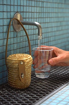 Glass with curative water, spa of Vichy, Auvergne, France, Europe