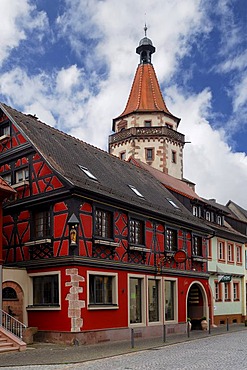 Old half-timbered house built in 1704, Niggelturm tower at the back, 16th century, Hauptstrasse street, Gengenbach, Baden-Wuerttemberg, Germany, Europe