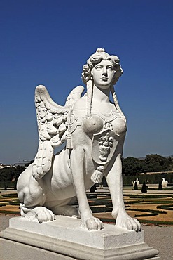 Sculpture of a sphinx against a blue sky at the Oberes Schloss Belvedere palace, Unteres Schloss Belvedere palace at the back, Prinz-Eugen-Strasse street 27, Vienna, Austria, Europe