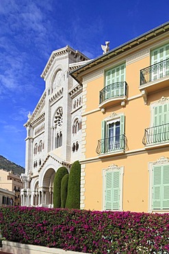 Facade of the Notre-Dame-Immaculate Cathedral with residential building on the Rock of Monaco, Principality of Monaco, Cote d'Azur, Europe