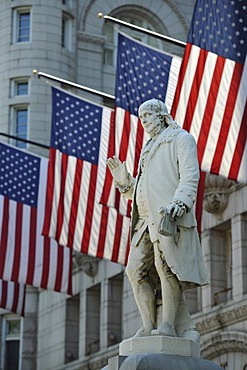 Benjamin Franklin statue in front of the Nancy Hanks Center, NEA, former Old Post Office Pavilion, US flags, Washington DC, District of Columbia, United States of America, PublicGround