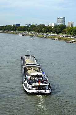 Freight ship transporting sand near Duesseldorf, Sky Office Building, navigation on the Rhine River, Duesseldorf, North Rhine-Westphalia, Germany, Europe