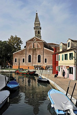 Colourfully painted houses, leaning church tower, boats on the canal, Burano, an island in the Venetian Lagoon, Italy, Europe