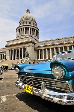 Vintage car in front of El Capitolio or National Capitol Building, home of the Cuban Academy of Sciences, Havana, Cuba, Caribbean