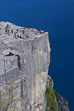 Tourists standing on Pulpit Rock, also known as Preikestolen, Jorpeland, Rogaland, Norway, Scandinavia, Northern Europe