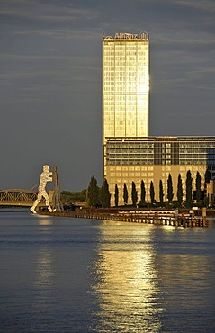 Molecule Man, a 30m high monumental work of art by sculptor Jonathan Borofsky, beside Eisenbruecke Bridge, Allianz SE Tower and Treptow-Towers, Friedrichshain-Kreuzberg, Berlin, Germany, Europe