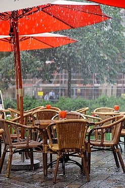 Rain in an outdoor restaurant, Hackescher Markt, Mitte district, Berlin, Germany, Europe