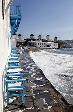 Chairs and tables of a pub, old houses by the sea, "Little Venice" district, old town of Mykonos Town, Mykonos, Greece, Europe