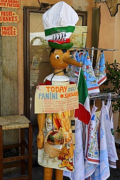 Pinocchio as a promotional figure in front of a restaurant in the Via Santa Maria, Pisa, Tuscany, Italy, Europe