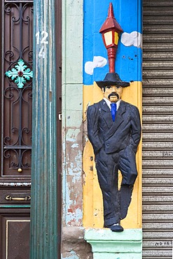 Facade relief of a man, El Caminito street, La Boca district, Buenos Aires, Argentina, South America