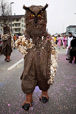 Individual dressed as an owl during the carnival procession, Littau, Lucerne, Switzerland, Europe