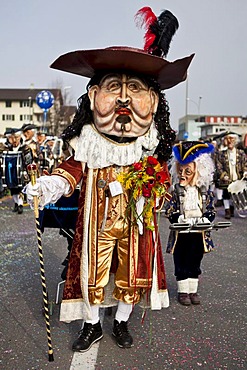 Guggenmusik Loechlitramper Littau music group dressed to the theme of 40 years of carnival battle during the carnival procession, Littau, Lucerne, Switzerland, Europe