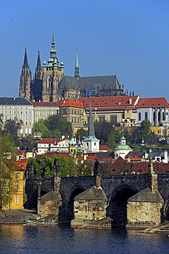 View over the Vltava River on the Charles Bridge and St. Vitus Cathedral in the early morning, Mala Strana, Prague, Bohemia, Czech Republic, Europe