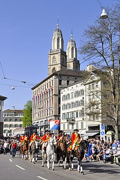 Reitclub St. Niklaus Zurich riding club at the traditional Sechselaeuten parade in the historic district of Zurich, the two steeples of Grossmuenster church at the back, Canton of Zurich, Switzerland, Europe