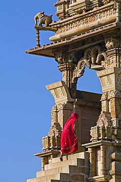 Women wearing a sari climbing the steps to Kandariya Mahadev Temple, Khajuraho Group of Monuments, UNESCO World Heritage Site, Madhya Pradesh, India, Asia