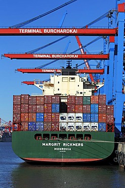 Container ship, Margrit Rickmers, being loaded with containers at the Container Terminal Burchardkai in the Port of Hamburg on the Elbe River, Hamburg, Germany, Europe