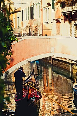 Gondolier, canal, Venice, Venezia, Veneto, Italy, Europe