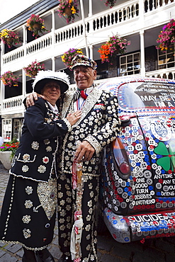 Pearly King and Queen and decorated London taxi, London, England, United Kingdom, Europe