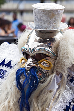 Masked participant in the Carnaval Del Pueblo Festival, Europes largest Latin Street Festival, Southwark, England, United Kingdom, Europe