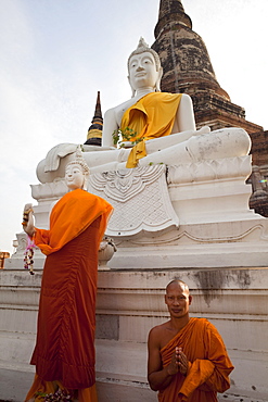 Monk in front of Buddha statue at Wat Yai Chai Mongkhon, Ayutthaya Historical Park, UNESCO World Heritage Site, Ayutthaya, Thailand, Southeast Asia, Asia