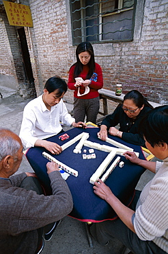 People playing Mahjong, a gambling game, in the street, Beijing, China, Asia