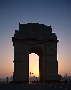 Silhouette of India Gate at sunrise, Delhi, India, Asia