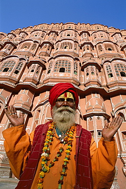 Sadhu outside the Palace of the Winds (Hawa Mahal), Jaipur, Rajasthan, India, Asia