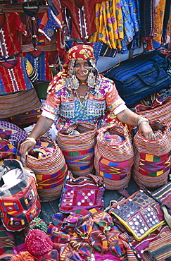 Gypsy vendor selling local crafts, Anjuna Market, Goa, India, Asia