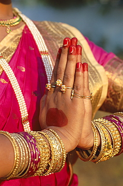 Traditional costume and detail of hands in traditional Indian greeting pose, Mumbai (Bombay), Maharastra, India, Asia