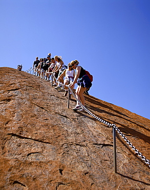 Tourists climbing Ayers Rock (Uluru), Uluru-Kata Tjuta National Park, UNESCO World Heritage Site, Northern Territory, Australia, Pacific