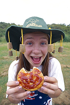 Girl eating a meat pie, Sydney, New South Wales, Australia, Pacific