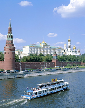 The Kremlin, UNESCO World Heritage Site, and Moskva River with tourist boat, Moscow, Russia, Europe