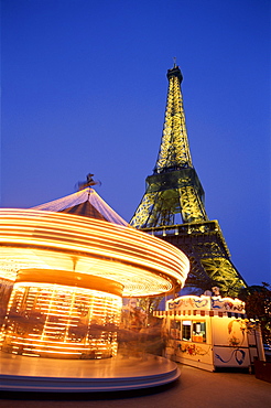 Eiffel Tower (Tour Eiffel) with carousel at night, Paris, France, Europe